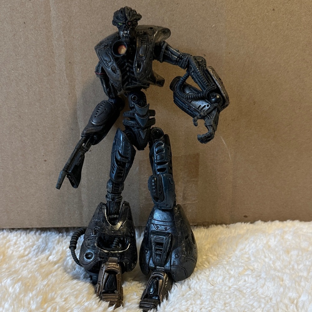 Black Sci‑Fi Robot Action Figure